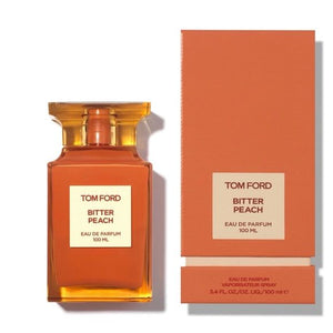 Tom Ford Bitter Peach Eau de Parfum 100ml unisex perfume orange bottle beside its orange box